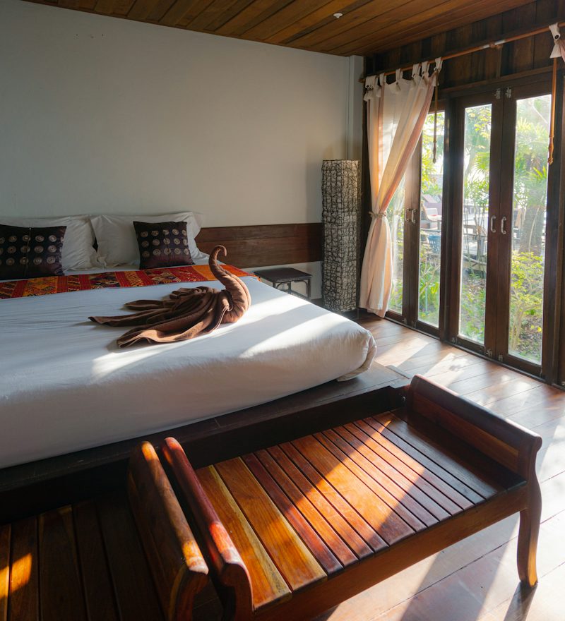 Elegant hotel bedroom with large windows